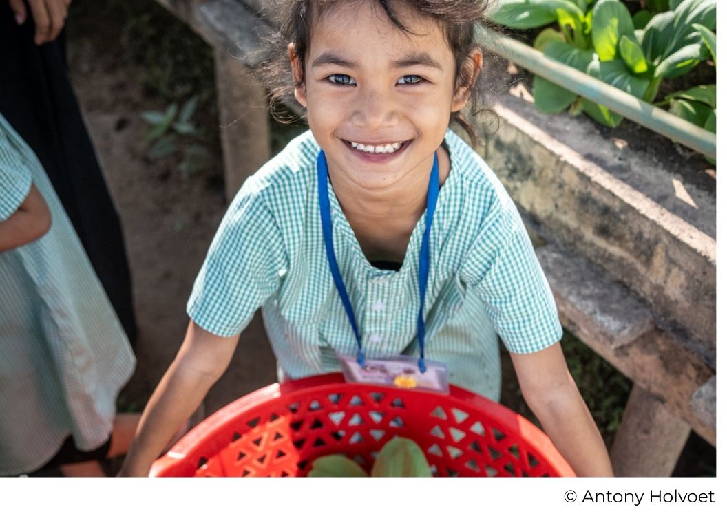 Young girl learning permaculture at the agroecological farm on Happy Chandara campus