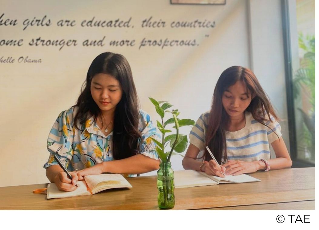 Happy Chandara students working together in a supportive student home environment