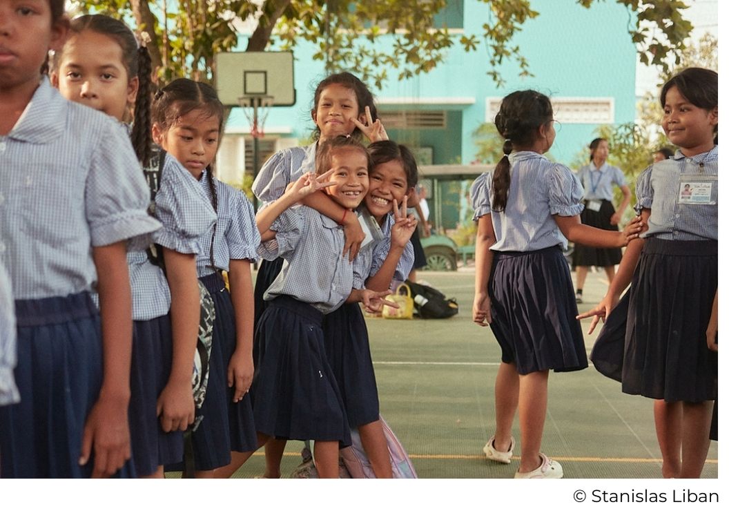 Smiling girls on the playground of Happy Chandara campus in Cambodia